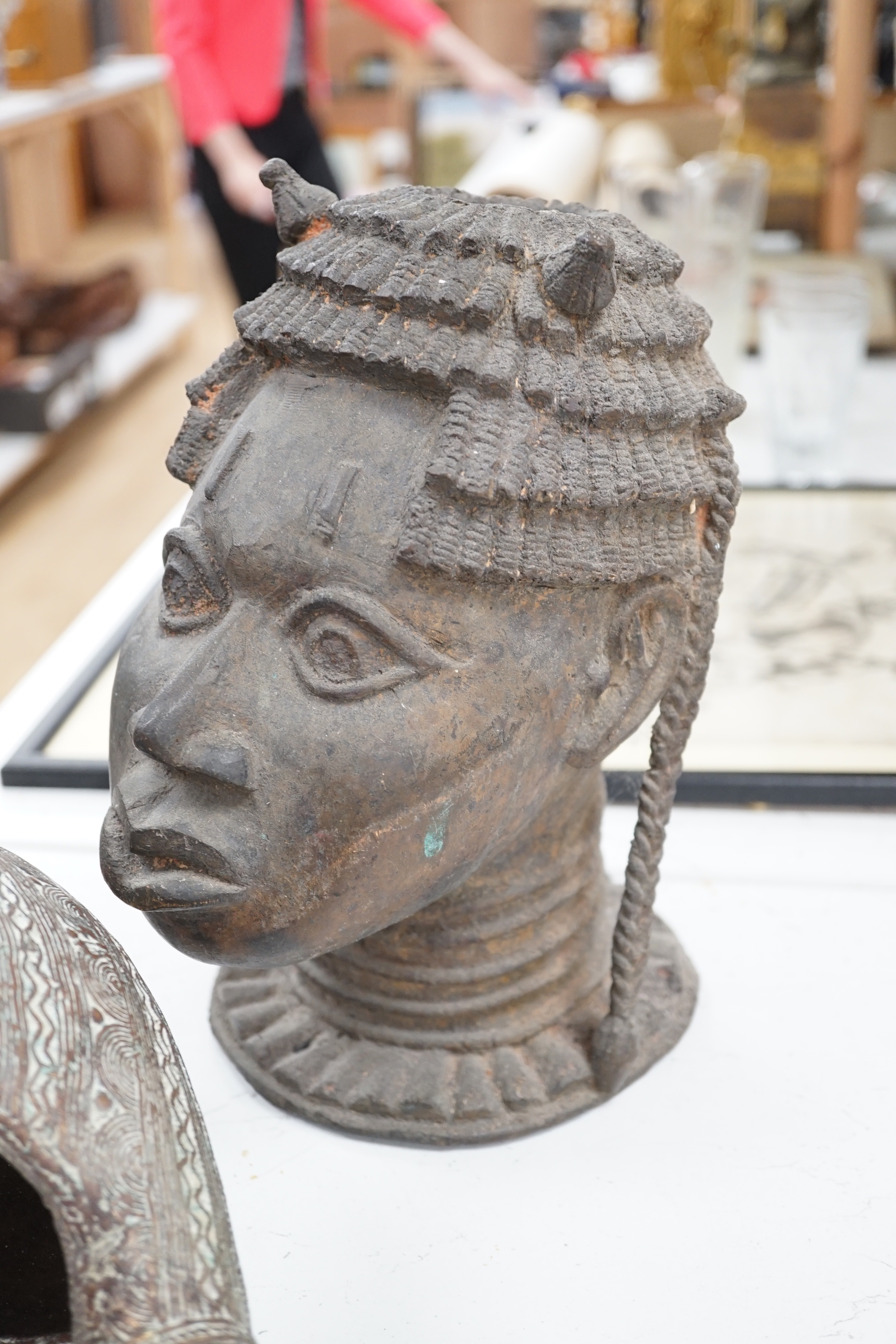 West African bronzes: Benin, a male and a female head, bangle anklet, a ceremonial pipe, ornamental ladle (5)